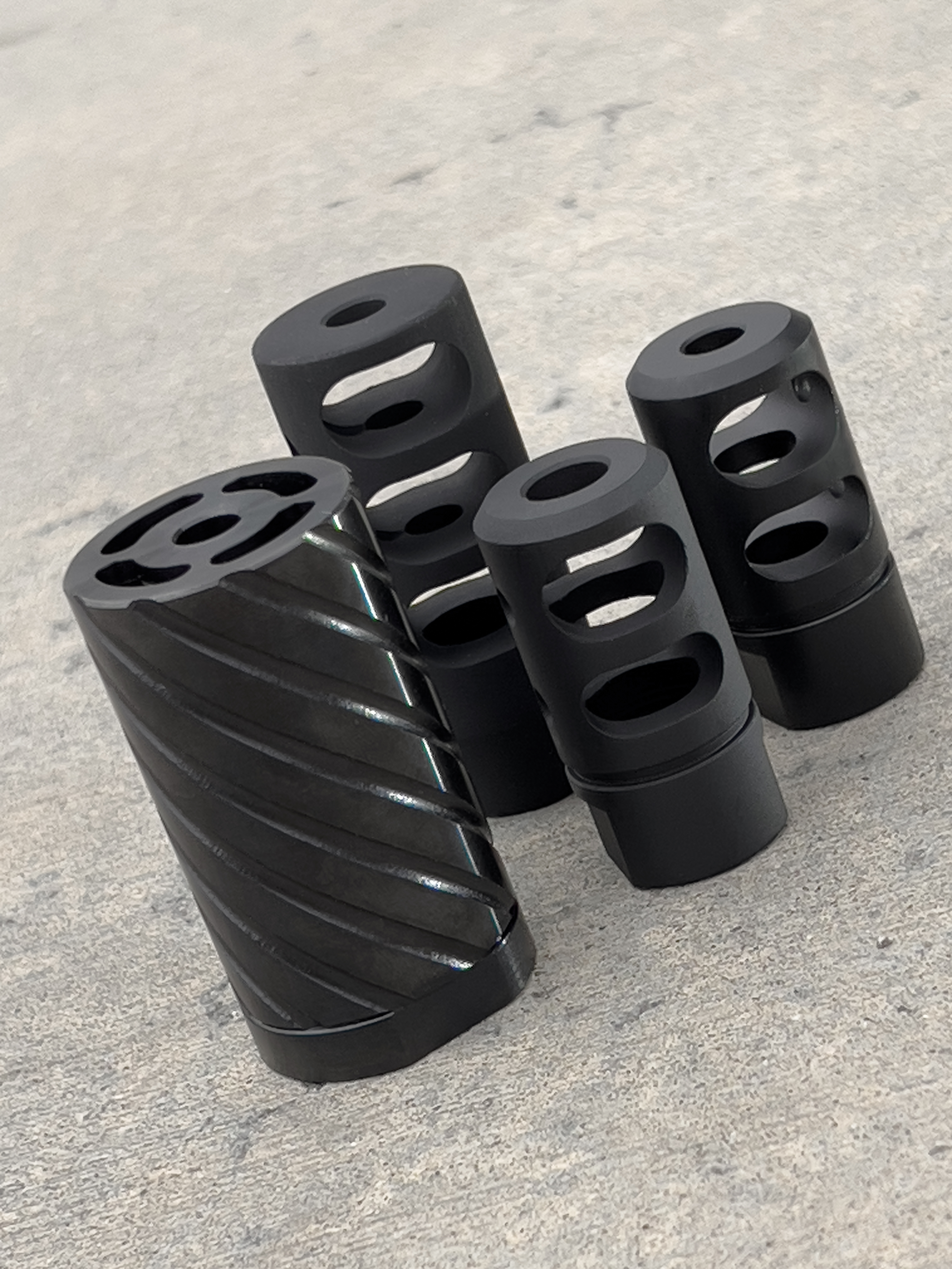 The difference between muzzle devices, muzzle brakes, compensators, and flash hiders.